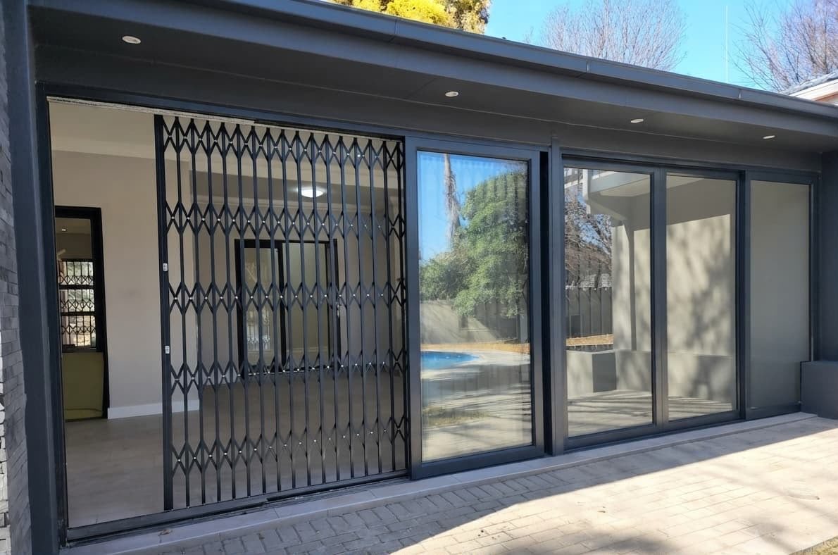 Aluminium sliding doors with the trellis security gate closed