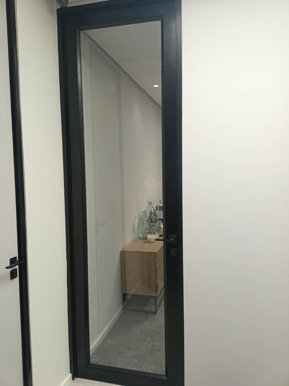 Black aluminium door and frame installed