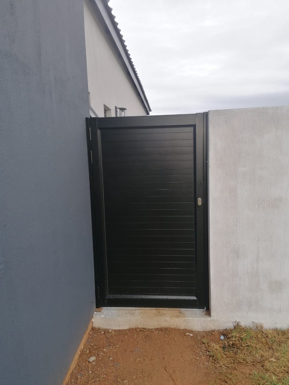 Black aluminium slatted pedestrian gate