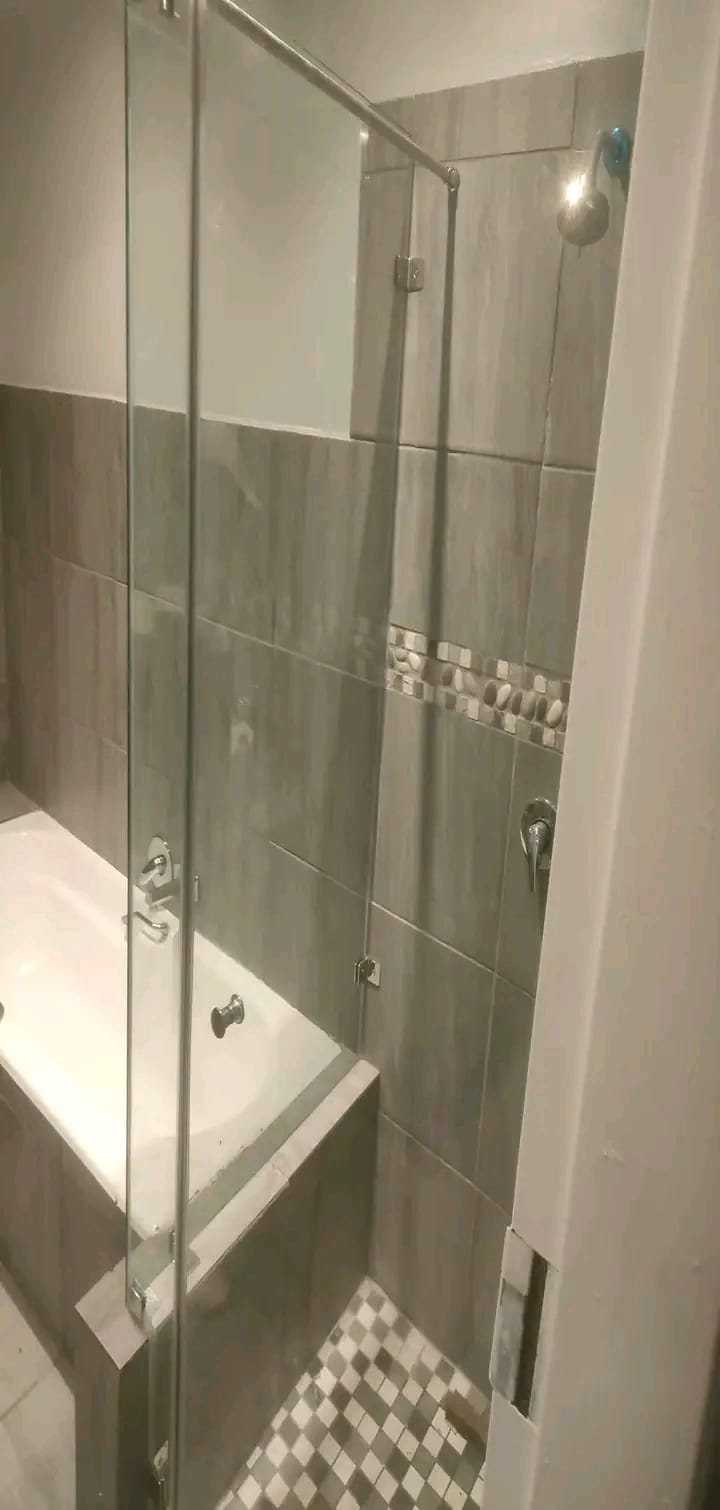 Frameless glass shower door installation