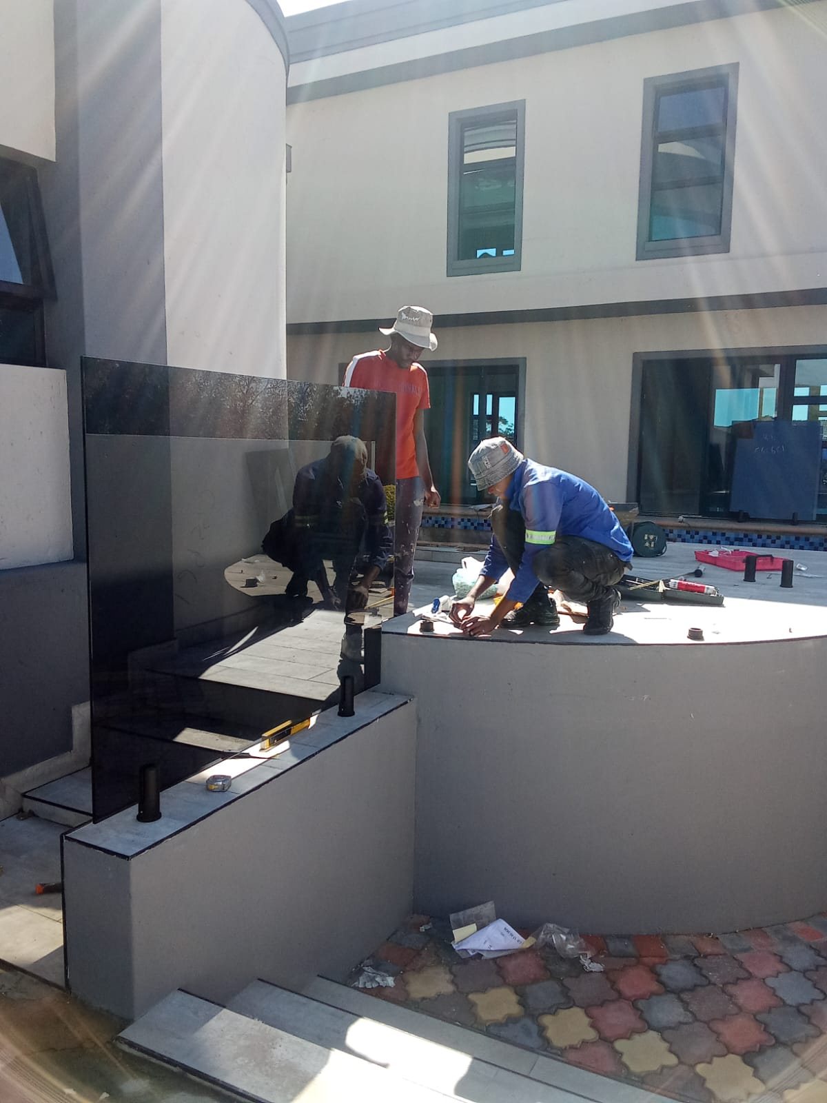 Elite Aluminium team installing a glass balustrade