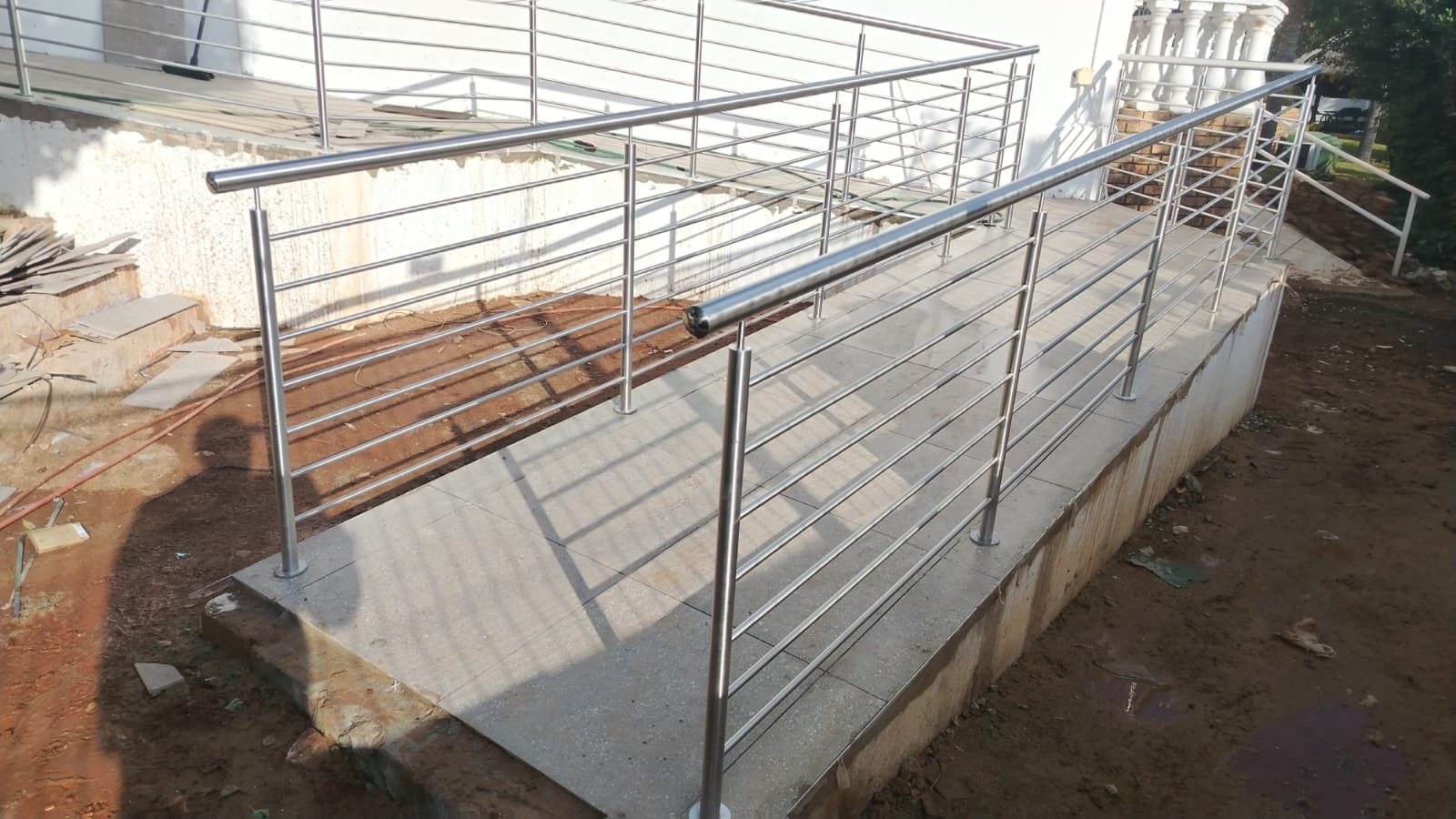 Stainless steel handrail on an access ramp